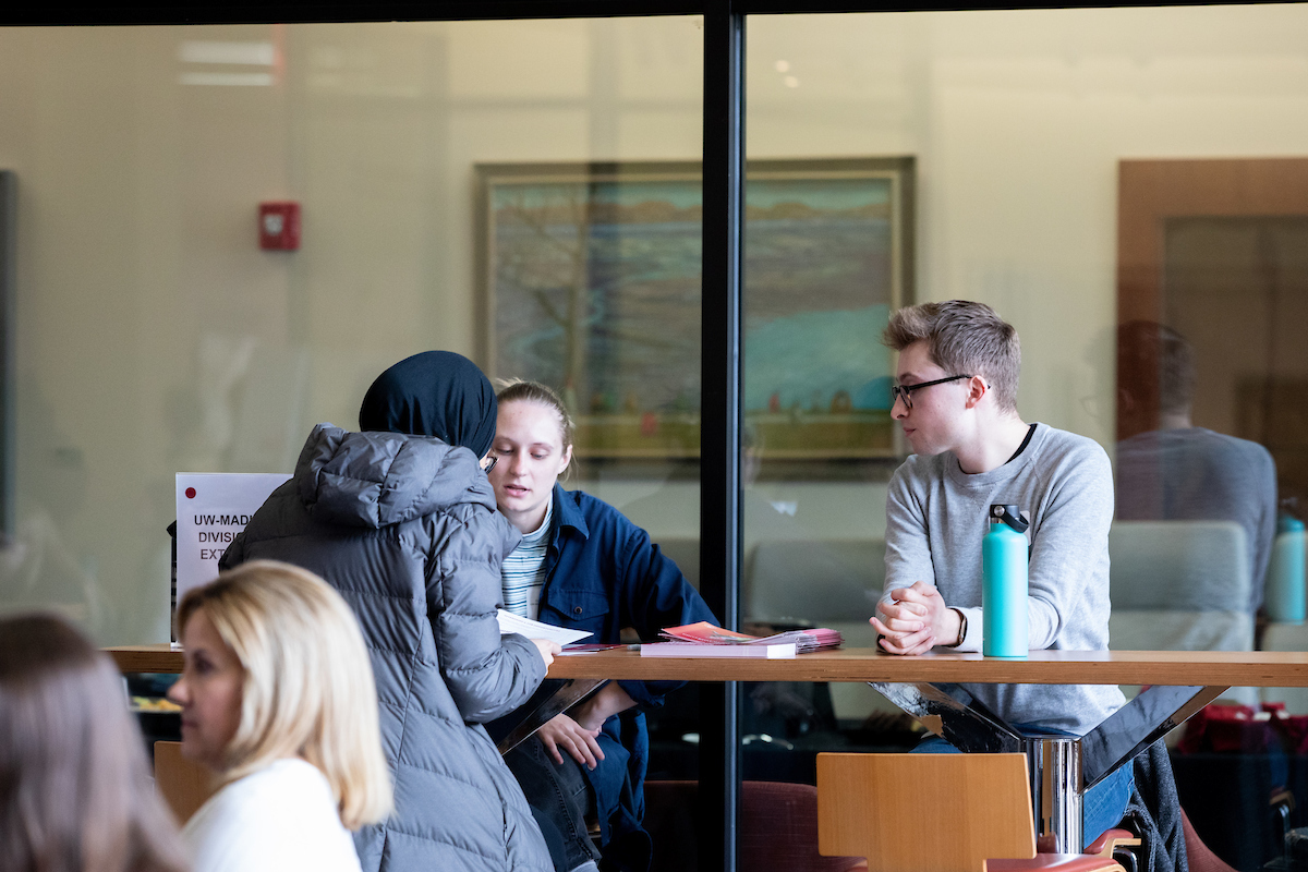 Students talking to a professional at a Career Connector