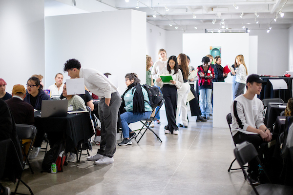 Students meeting with employers at networking fair