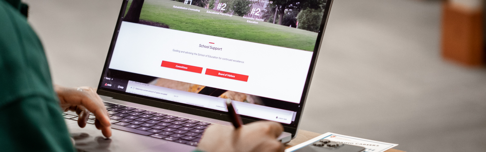 Explore hero image (student on laptop)