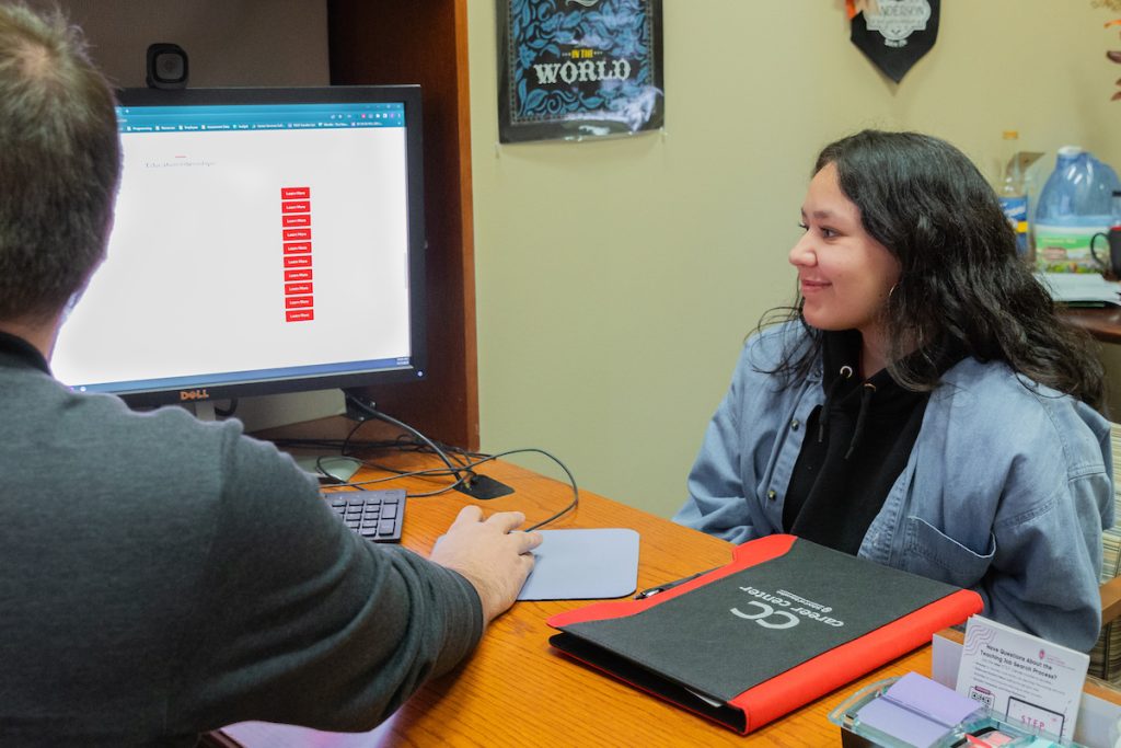 an advisor working with a student