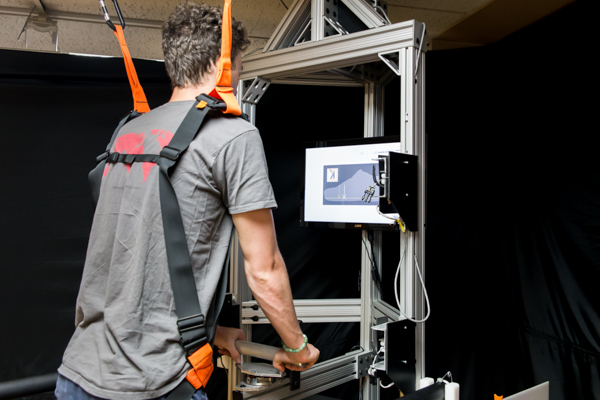 student getting data on moving in biomechanics lab