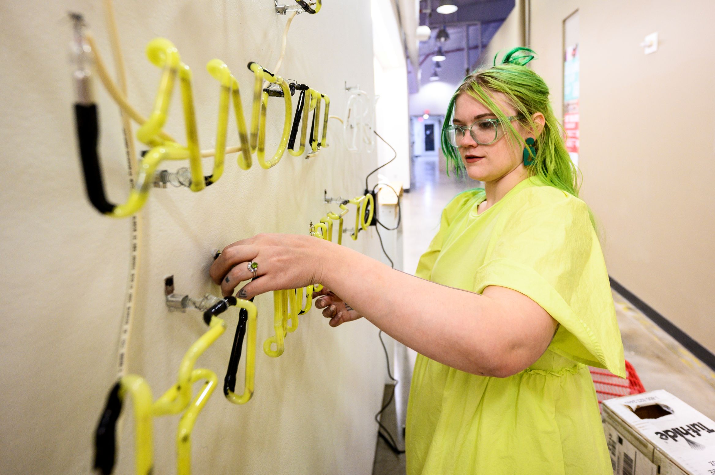 UW Madison artist working with neon and glass