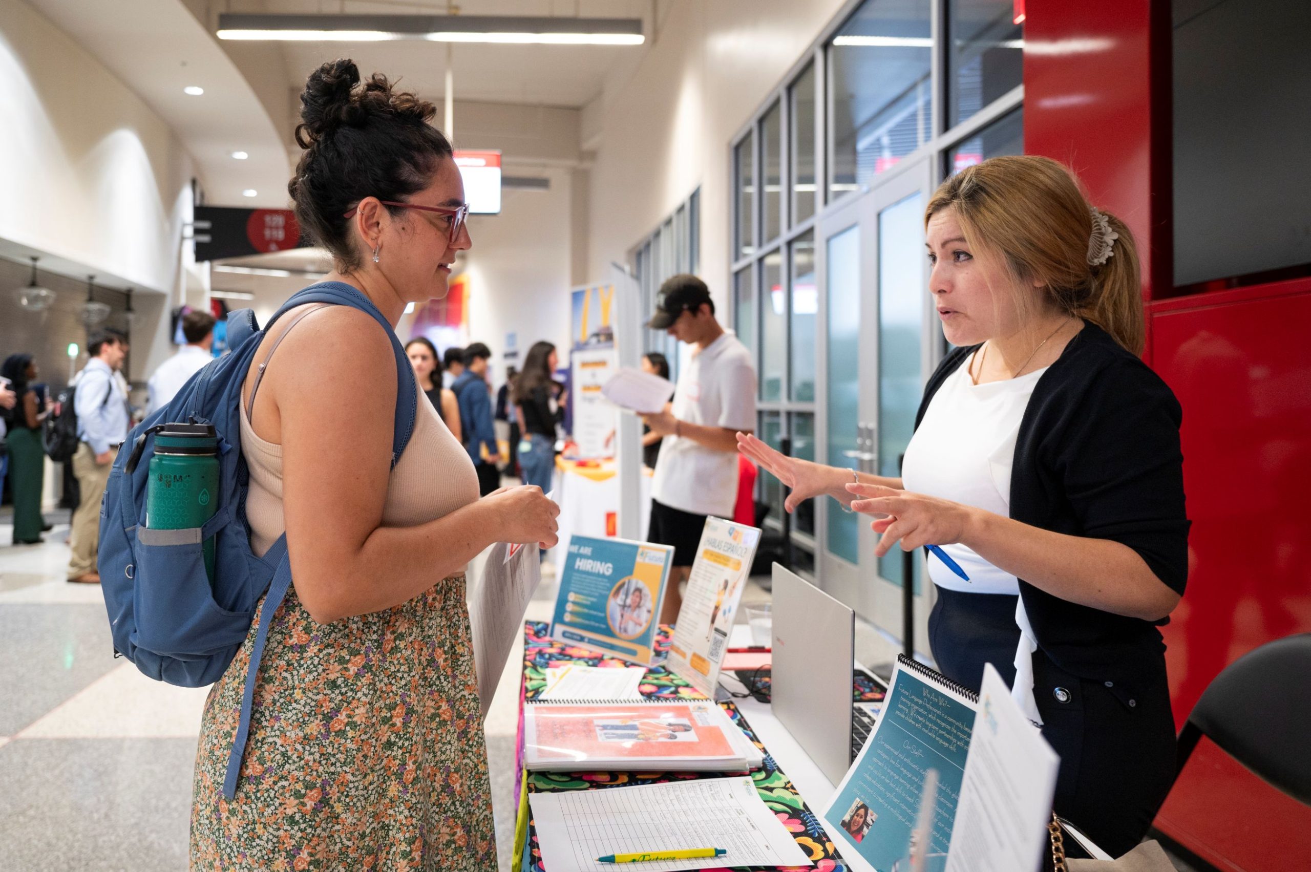 two people talking at a UW Madison event