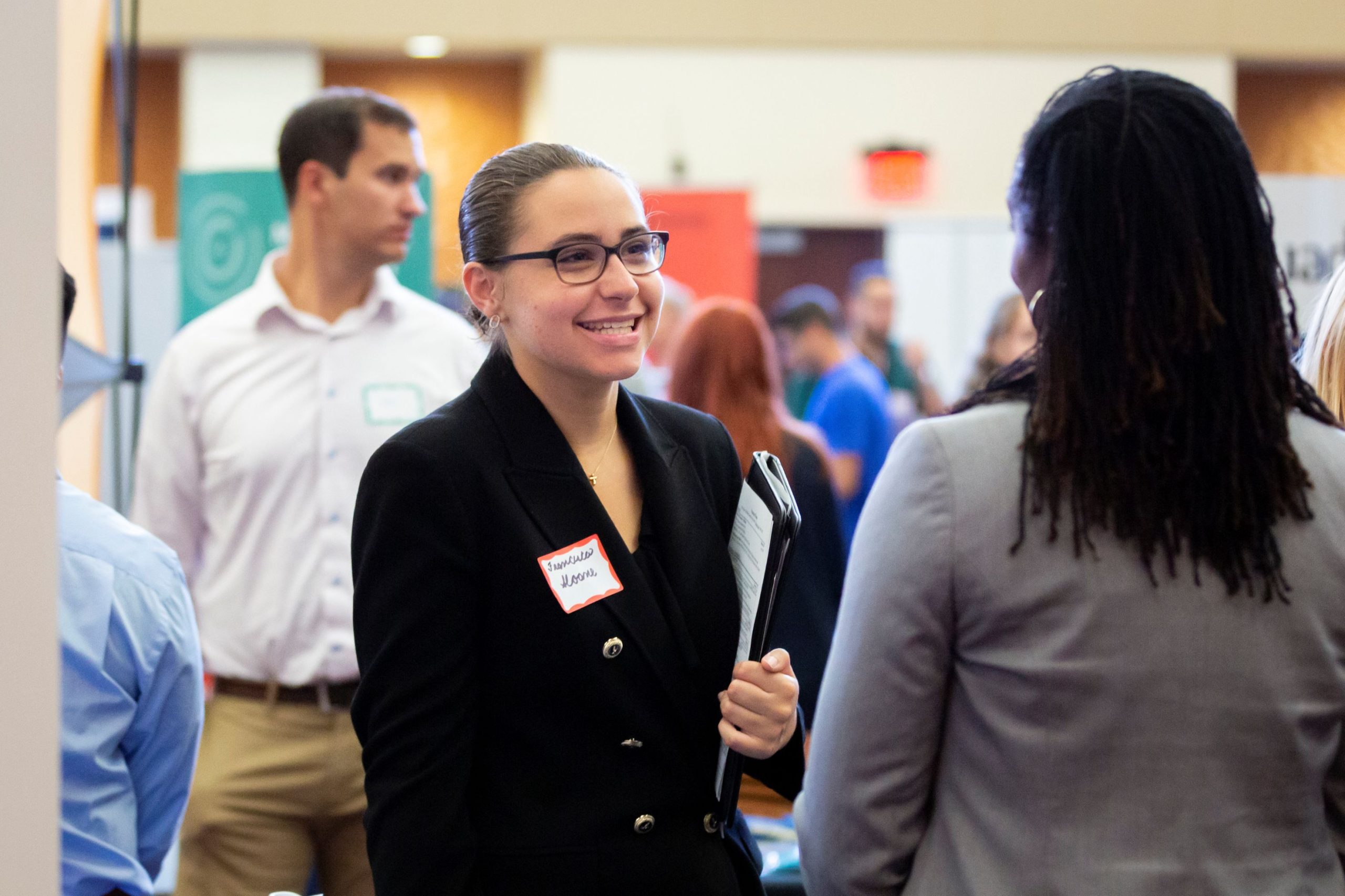 two people talking at an event