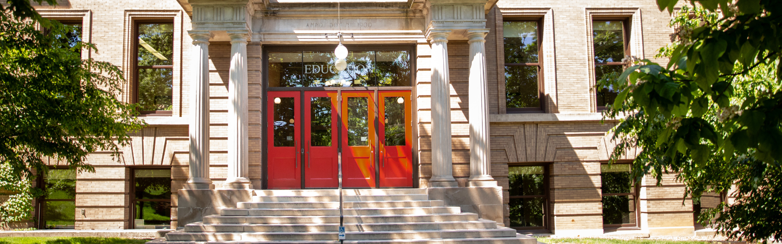 red doors outside of the education building
