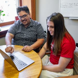 advisor working with a student