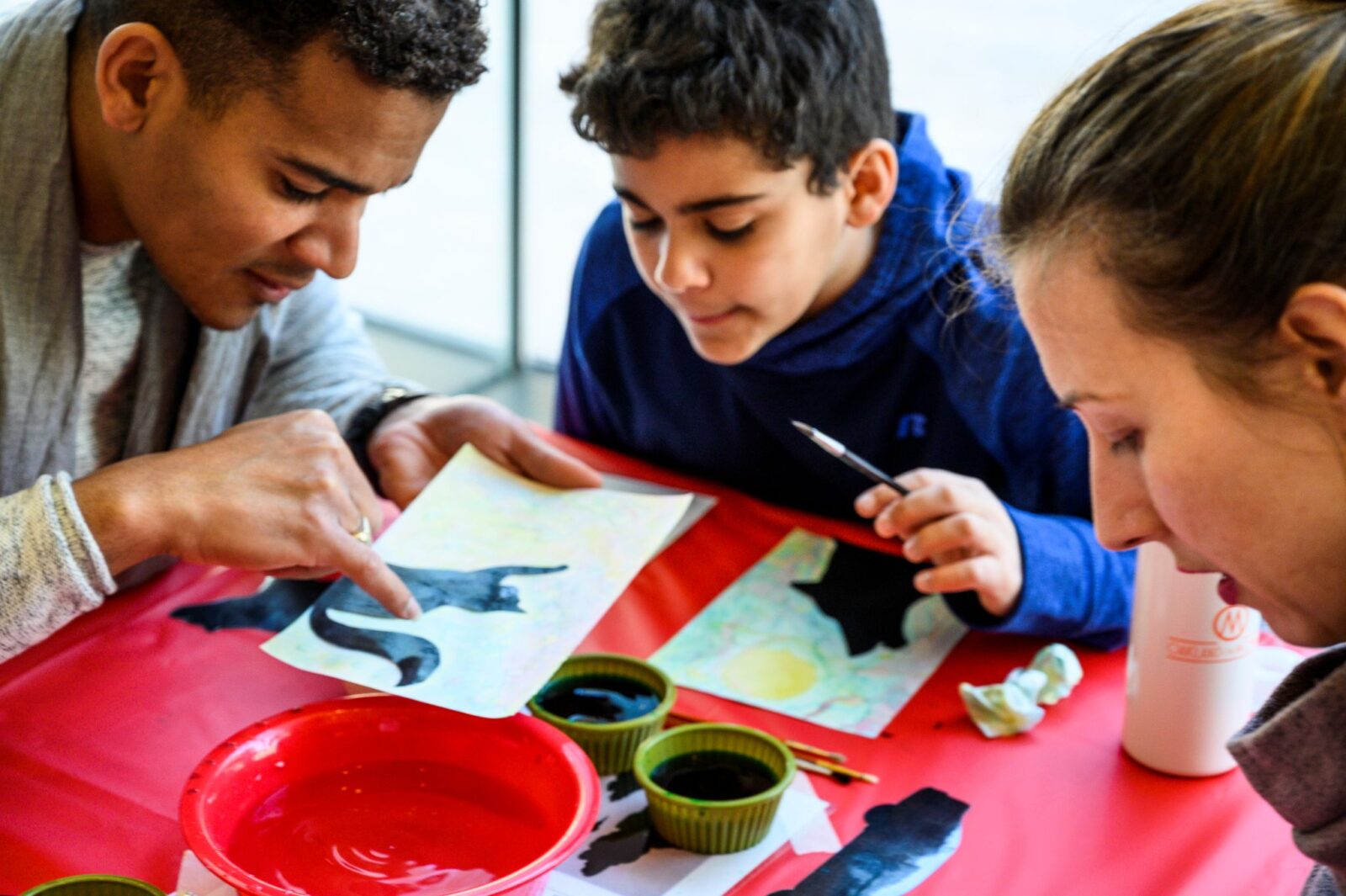 an art teacher working with students