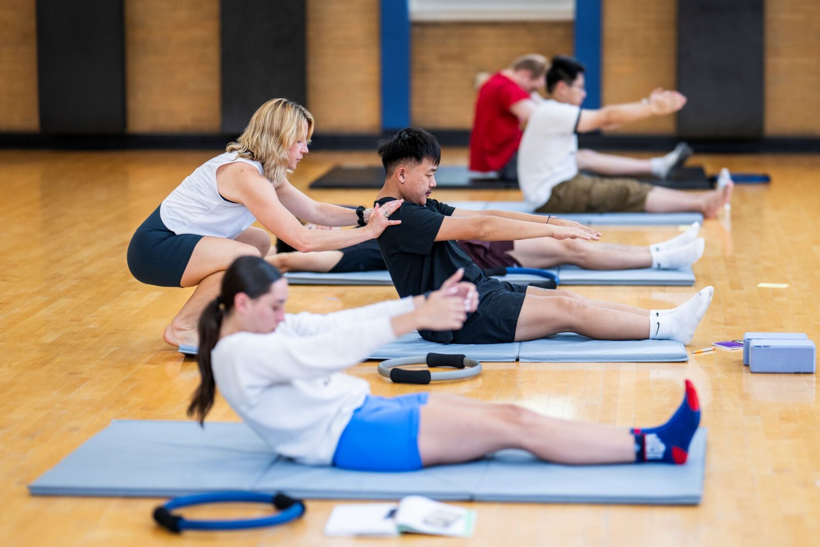 an instructor teaching sit ups