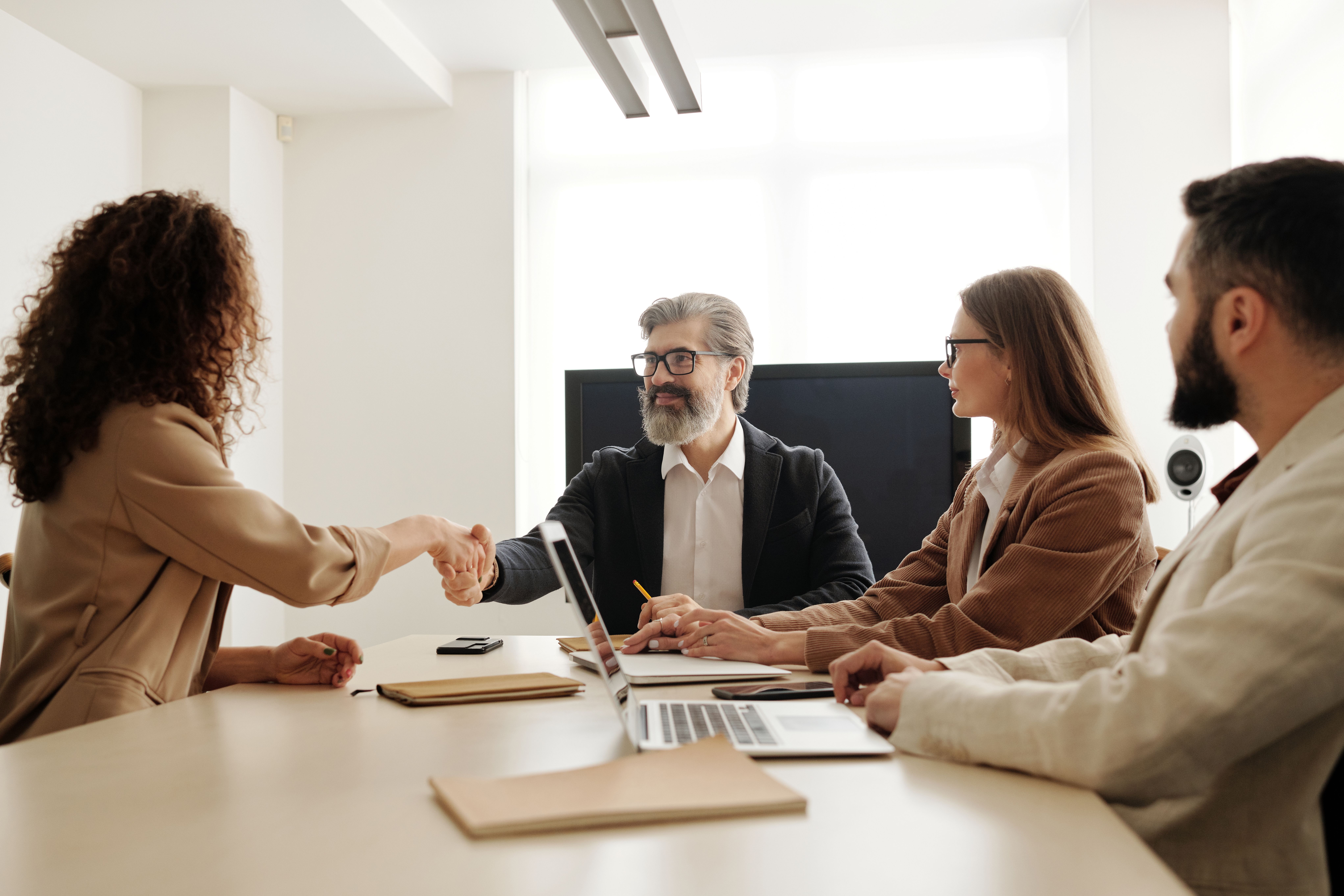 a person being interviewed by three other people