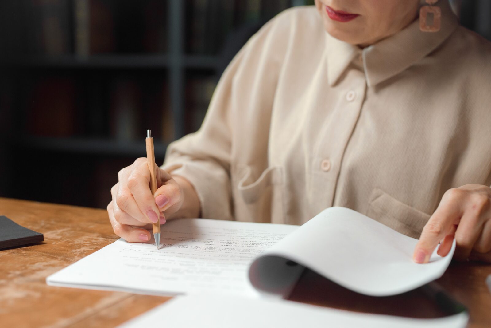 a person writing in a notebook