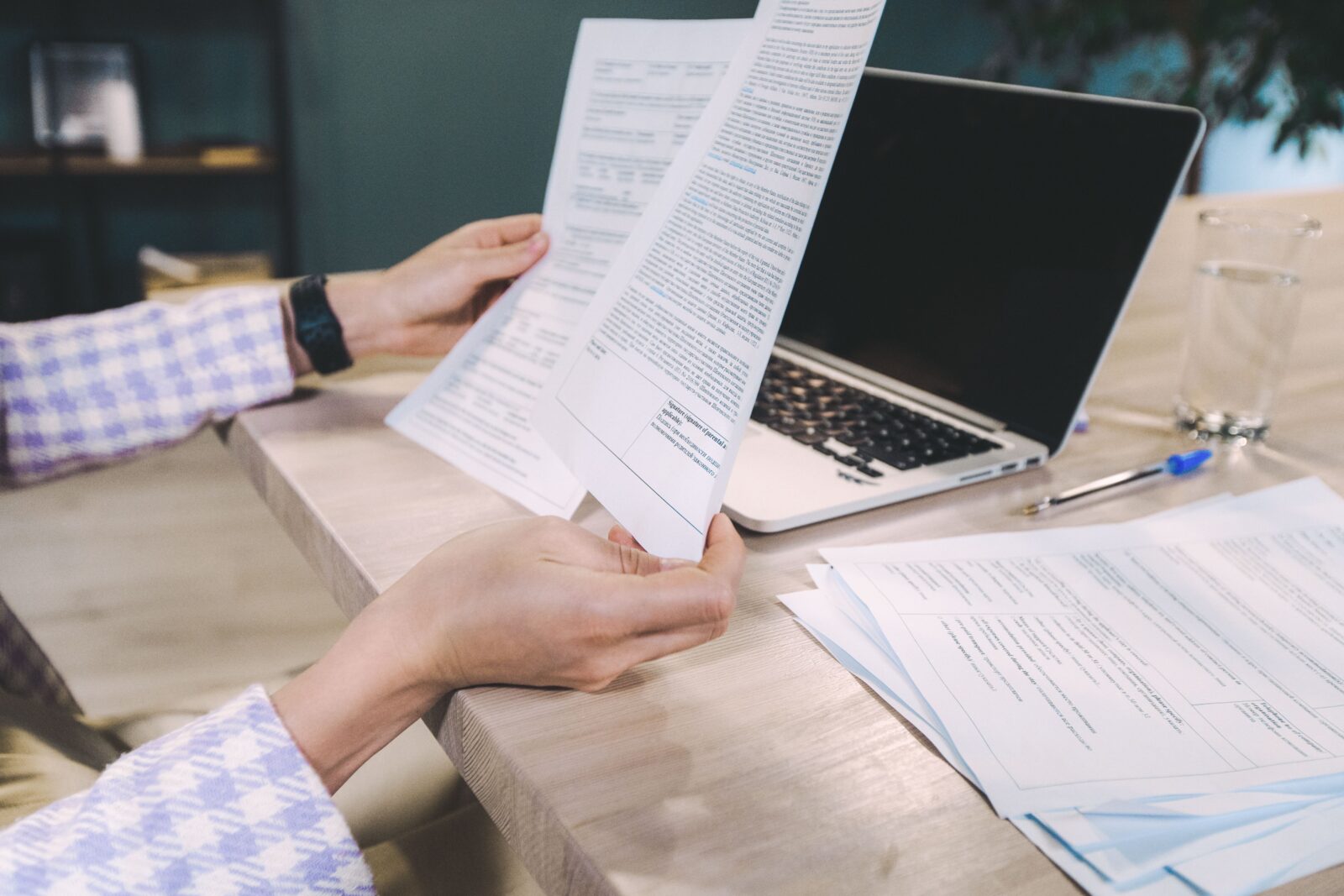 hands holding papers